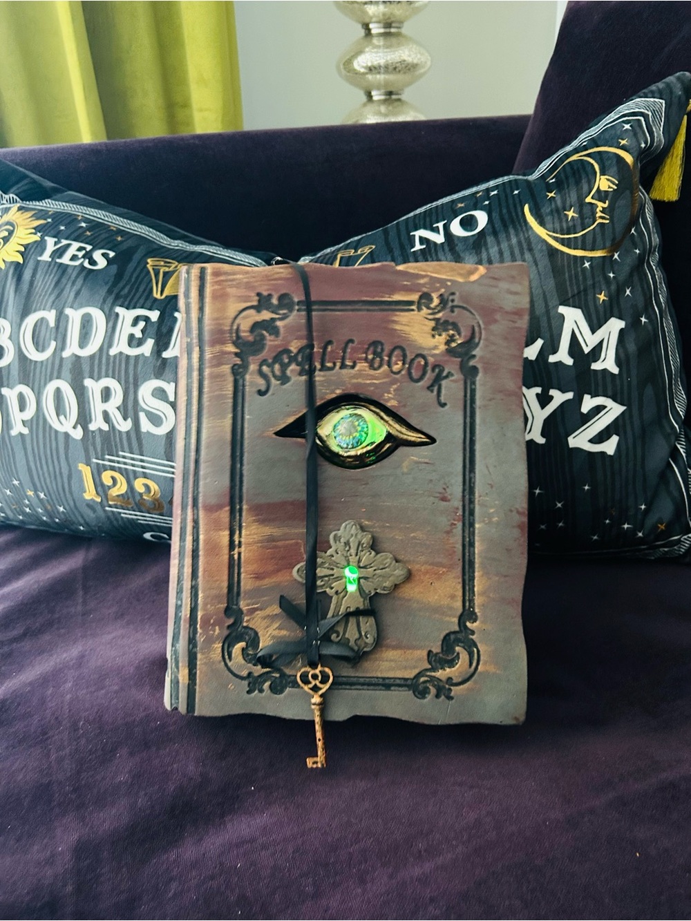 Spell Book Decorative Accent with Green Eye and Key.